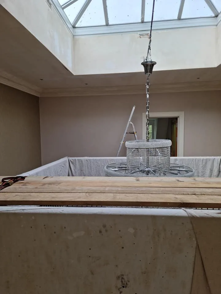 Room preparation work under a roof lantern before painting